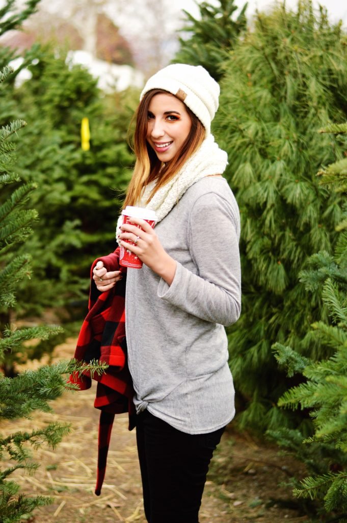 Simple Addiction Boutique outfit with a little twist top and distressed jeans. A perfect cozy winter outfit! Get 15% off your order with this exclusive Simple Addiction Coupon Code! 