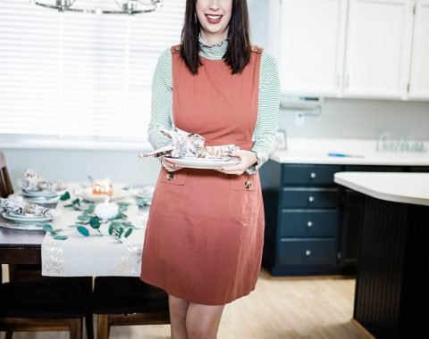 Thanksgiving Day Outfit Idea, featuring rust orange jumper dress, striped mocked turtleneck. This modest outfit is perfect for hosting a holiday dinner and features trendy boutique pieces from My Sister's Closet Boutique. // Hey There, Chelsie