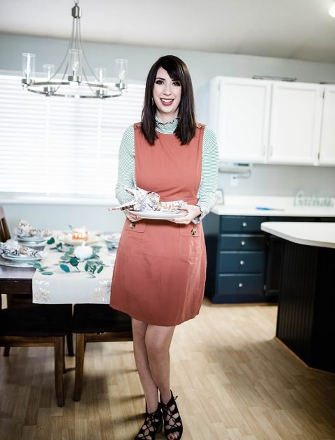 Thanksgiving Day Outfit Idea, featuring rust orange jumper dress, striped mocked turtleneck. This modest outfit is perfect for hosting a holiday dinner and features trendy boutique pieces from My Sister's Closet Boutique. // Hey There, Chelsie